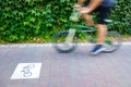 Motion blurred cyclists to show speed, driving along a bike lane, and make transport and urban displacements more sustainable Royalty Free Stock Photo