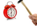 Motion blurred hammer hits red alarm clock isolated on white background, stop ringing concept with copy space