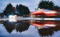 Blurred car reflection in puddle Royalty Free Stock Photo