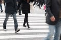 Motion blurred people across Pedestrians at Shibuya Junction, T