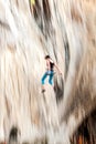 Motion blurred rock climber falling down Royalty Free Stock Photo