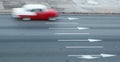 Motion-blurred 1950`s Chevy drives on road in Havana, Cuba Royalty Free Stock Photo