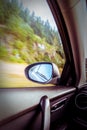 Motion blurred speeding car on country road Royalty Free Stock Photo