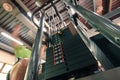 Motion blurred unrecognizable person doing upper traction gym machine