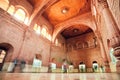 Motion blurs from walking tourists inside carved room of 16th century Junagarh Fort Royalty Free Stock Photo