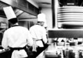 Motion chefs of a restaurant kitchen, Chef motion make food black and white Royalty Free Stock Photo