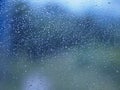 Motion drop rain on mirror window glass car in road rainy season Royalty Free Stock Photo