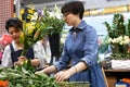 Motion of florist prepares a bouquet of flowers for customer in Taipei Taiwan.