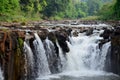 Motion and flowing water of Tad Pha Suam waterfall Royalty Free Stock Photo