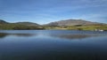 Motion lapse of a boat on Llyn Dywarchen with Yr Wyddfa in the background