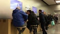 Motion of people having some service at genius bar inside Apple store