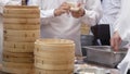 Motion of people mading dumplings inside Chinese restaurant