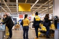 Motion of people paying product at self check out counter inside Ikea store