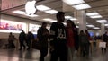 Motion of people playing iphone inside Apple store