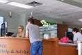 Motion of people talking to the teller at service counter inside TD bank