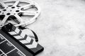 Motion picture film reel with movie clapper. Cinema concept