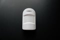 The motion sensor on the black wall. device that tracks the movement of objects. Royalty Free Stock Photo