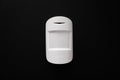 The motion sensor on the black wall. device that tracks the movement of objects. Royalty Free Stock Photo
