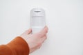 motion sensor in hand on the white background. device that tracks movement Royalty Free Stock Photo