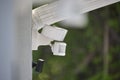 Motion sensor with light detector mounted on exterior wall of private house as part of security system Royalty Free Stock Photo