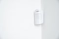 motion sensor in the white corner. device that tracks movement of objects. Royalty Free Stock Photo