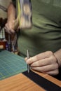 Motion Shot Punching a Hole for a Rivet Into Leather