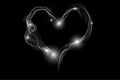 Motion of smoke heart shape isolated on the dark background Royalty Free Stock Photo