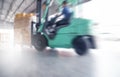 Motion speed blur of forklift driver loading shipment goods into container truck Royalty Free Stock Photo