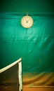 The clock weighs on the tennis court over the net, sports Royalty Free Stock Photo