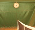 The clock weighs on the tennis court over the net, sports Royalty Free Stock Photo
