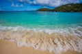 Motion waves break on the shore on Hawksnest beach in St. John