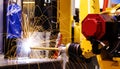 Motion Welding robots in factory with sparks, manufacturing, industry, factory Royalty Free Stock Photo