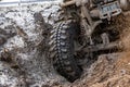 Motion the wheels tires off road water and mud splash, 4x4 or 4WD car with wheels in mud off road, Car stuck in puddle of mud, Royalty Free Stock Photo