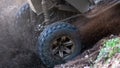 Motion the wheels tires off road water and mud splash, 4x4 or 4WD car with wheels in mud off road, Car stuck in puddle of mud, Royalty Free Stock Photo