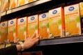 Motion of woman buying great value orange juice inside Walmart store