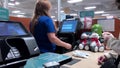 Motion of woman buying hairball paste at check out counter inside PetSmart store