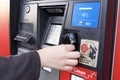 Motion of woman inserting card while paying gas