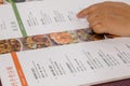 Motion of woman looking at menu inside Chinese restaurant