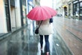 Motion of woman with pink ubrella