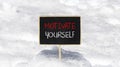 Motivate yourself symbol. Concept words Motivate yourself on beautiful black chalk blackboard. Chalkboard. Beautiful snow