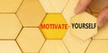 Motivate yourself symbol. Concept words Motivate yourself on beautiful wooden puzzles. Beautiful yellow paper background. Royalty Free Stock Photo