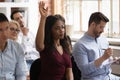 Motivated black female raise hand take part in training