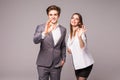 Motivated businessman and woman giving a okay gesture of approval and success as they pose side by side giving the camera big frie Royalty Free Stock Photo