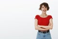 Motivated good-looking lively enthusiastic girl pixie short haircut cross arms body self-assured smiling amused excited