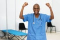 Motivated mature adult afro american male doctor at vaccination station