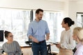 Motivated mixed race colleagues discussing project ideas. Royalty Free Stock Photo