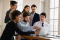 Motivated multiracial colleagues work together on laptop Royalty Free Stock Photo