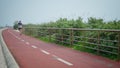 Motivated runner jogging urban track. Professional athlete training sprinting