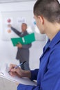 Motivated student taking notes in class Royalty Free Stock Photo