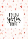 Motivating postcard with a handwritten phrase - Follow your heart. On a patterned background with a rainbow, hearts and